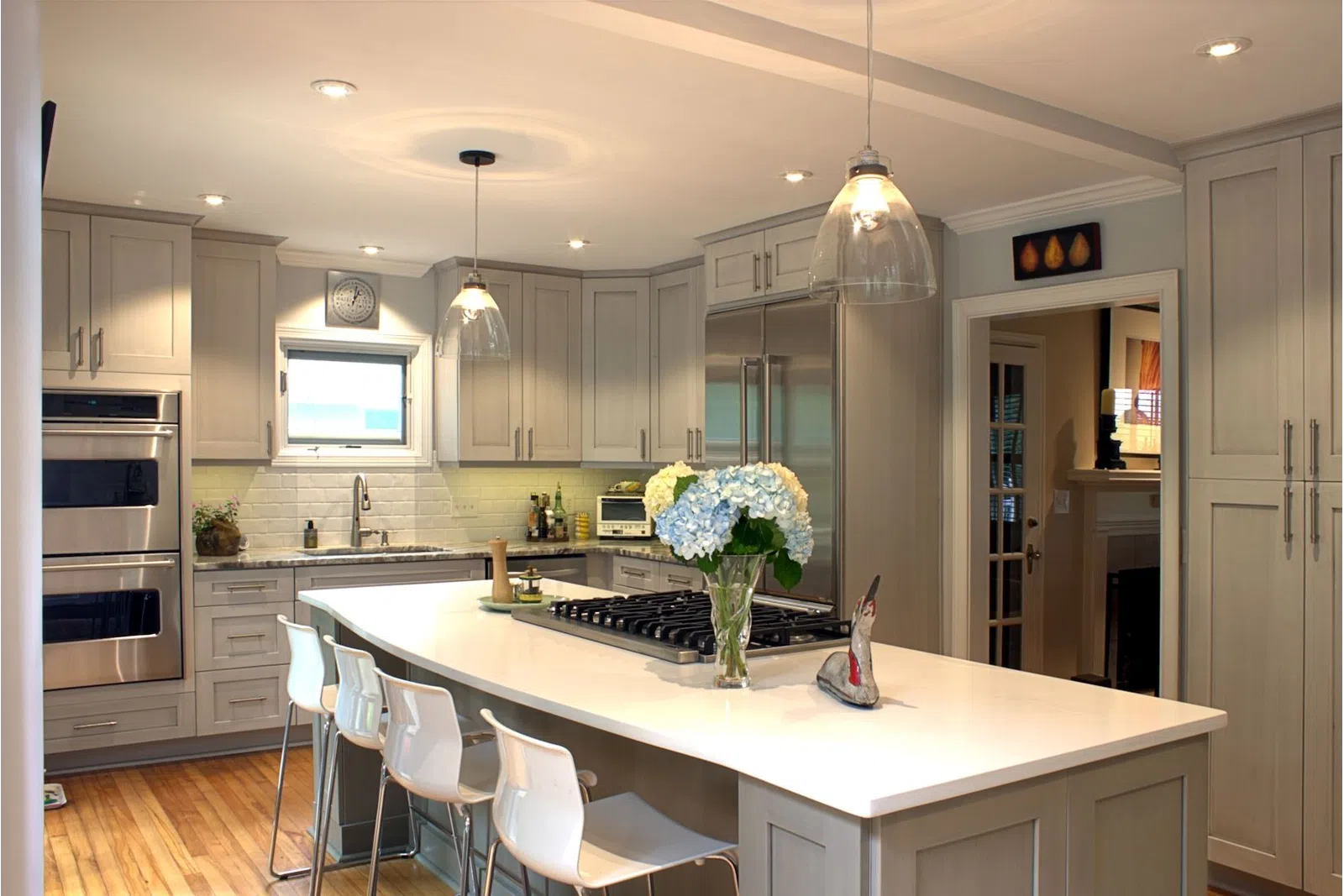 a modern kitchen with an island in the middle of a room