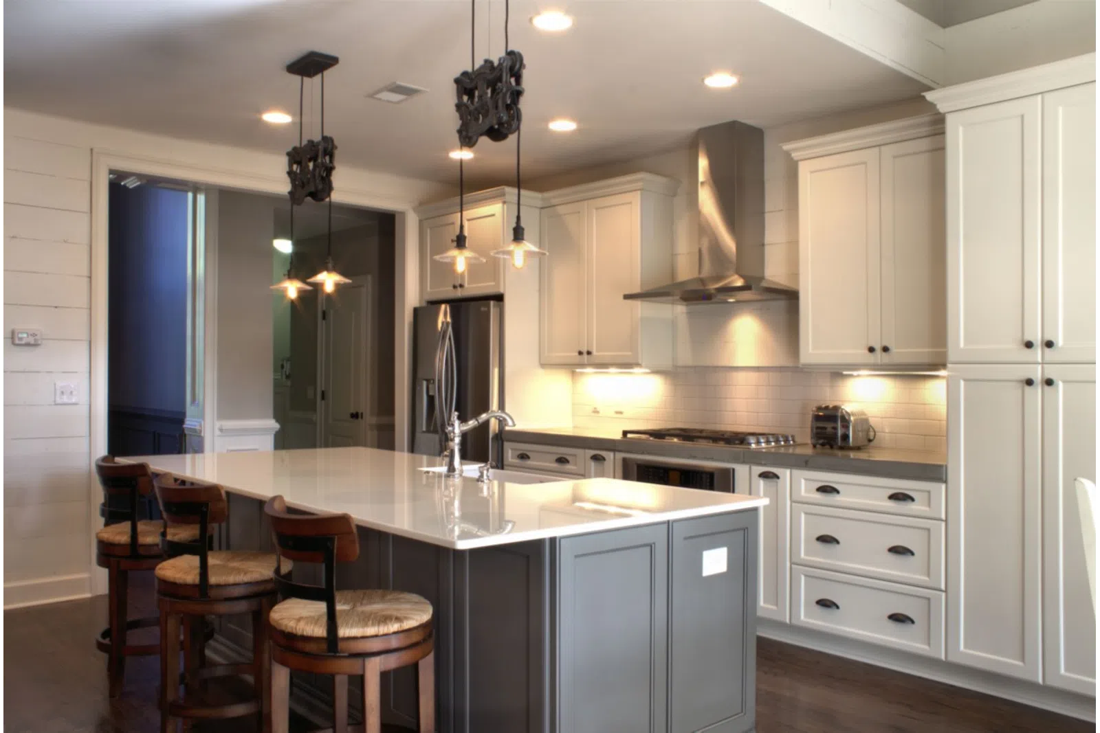 a modern kitchen with an island in the middle of a room