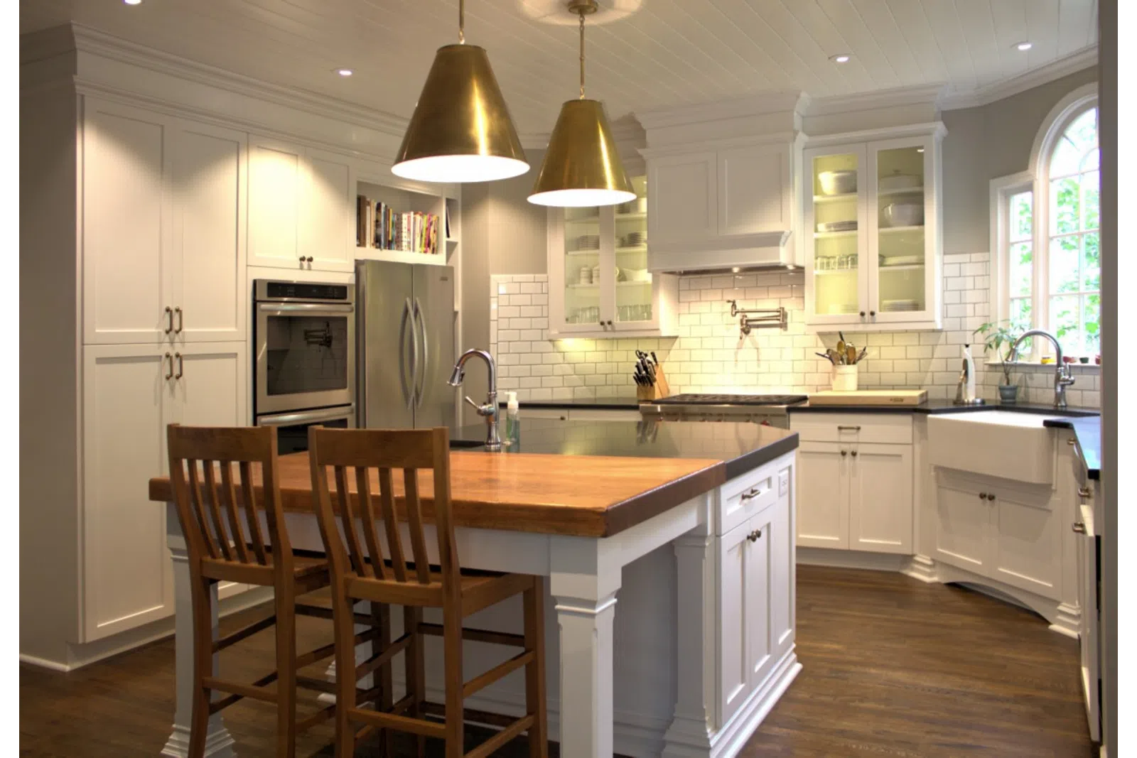 a kitchen with wooden cabinets and a dining room table
