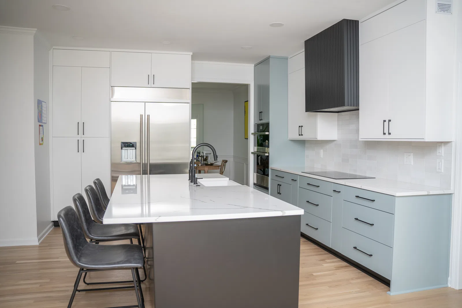 a kitchen with white cabinets