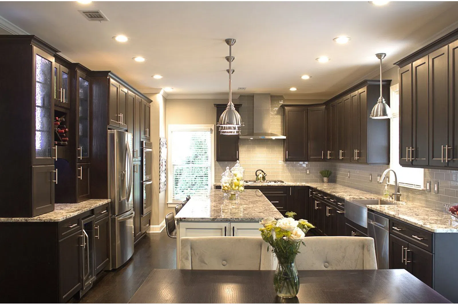 a large kitchen with stainless steel appliances
