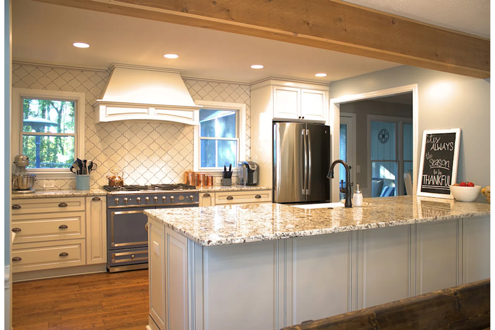 a large kitchen with stainless steel appliances