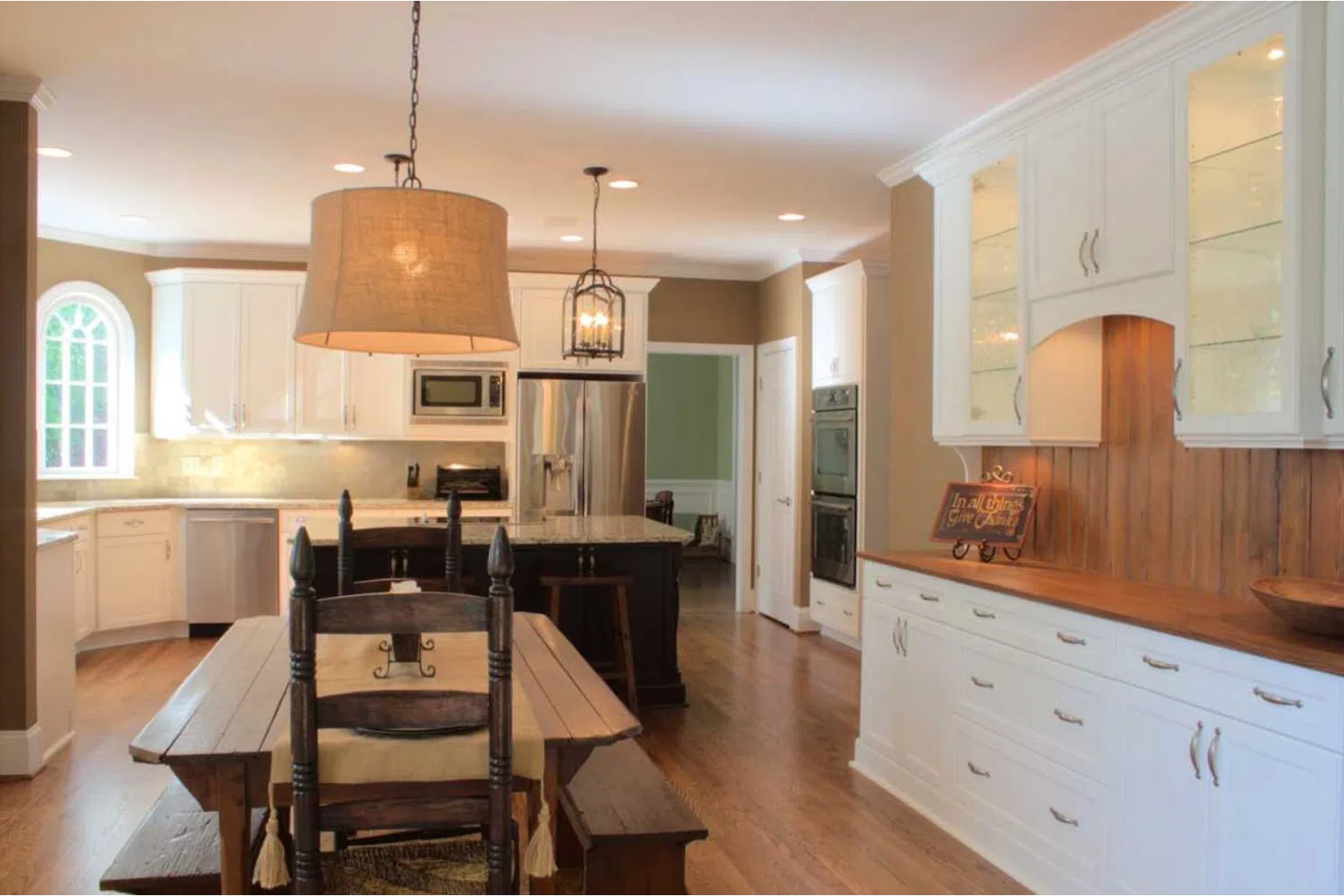 a kitchen with an island in the middle of a room