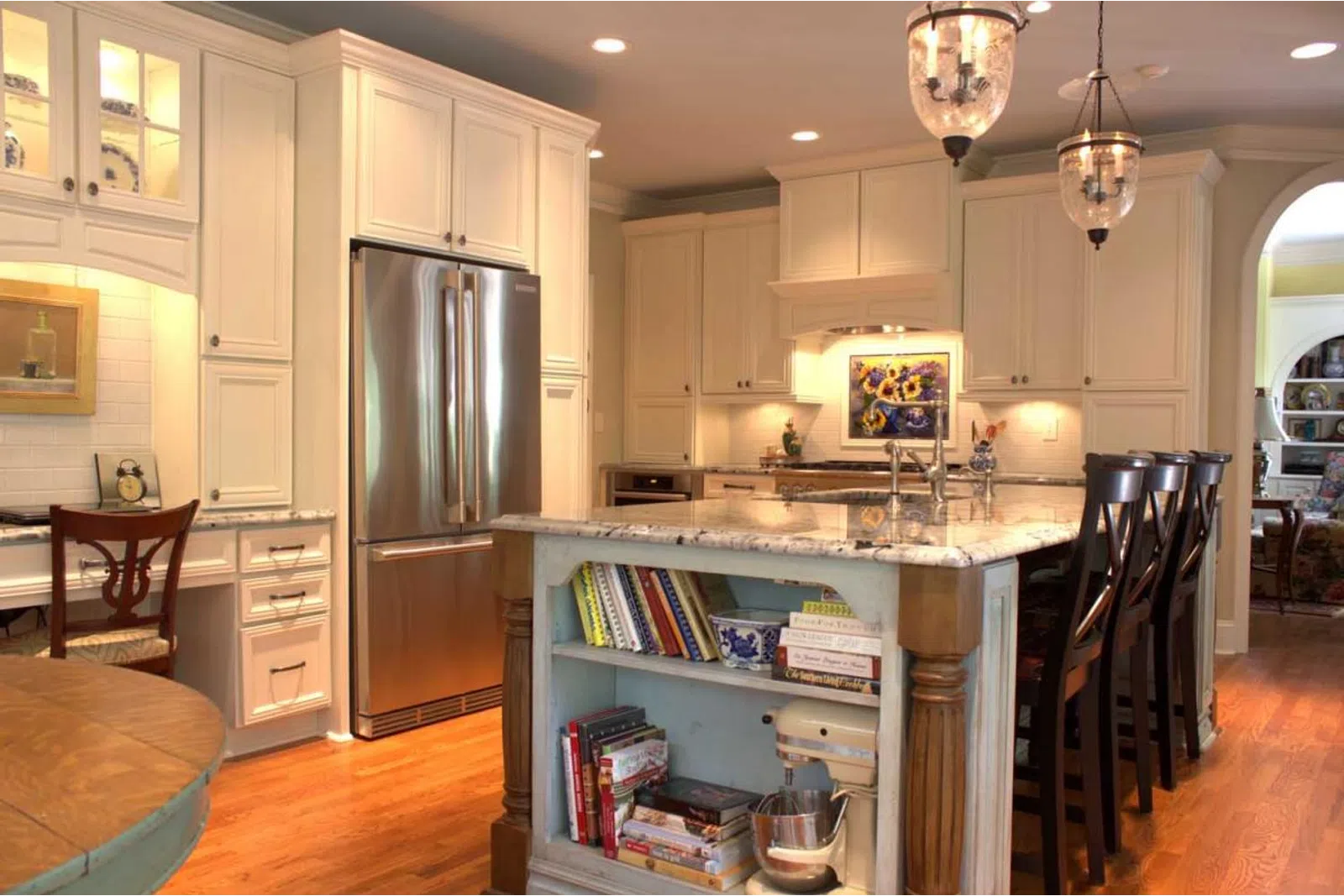 a kitchen with an island in the middle of a room