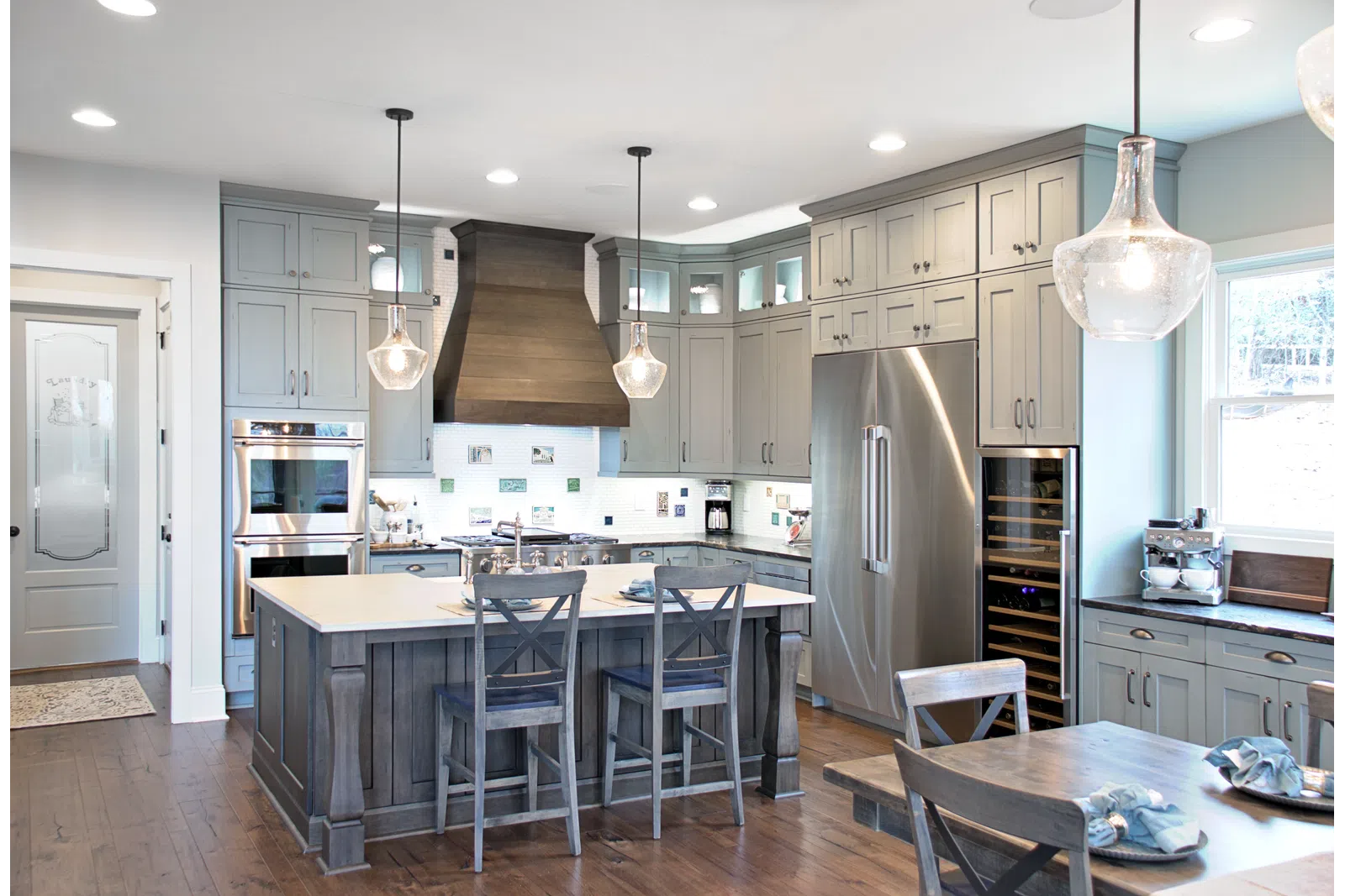 a kitchen with an island in the middle of a room