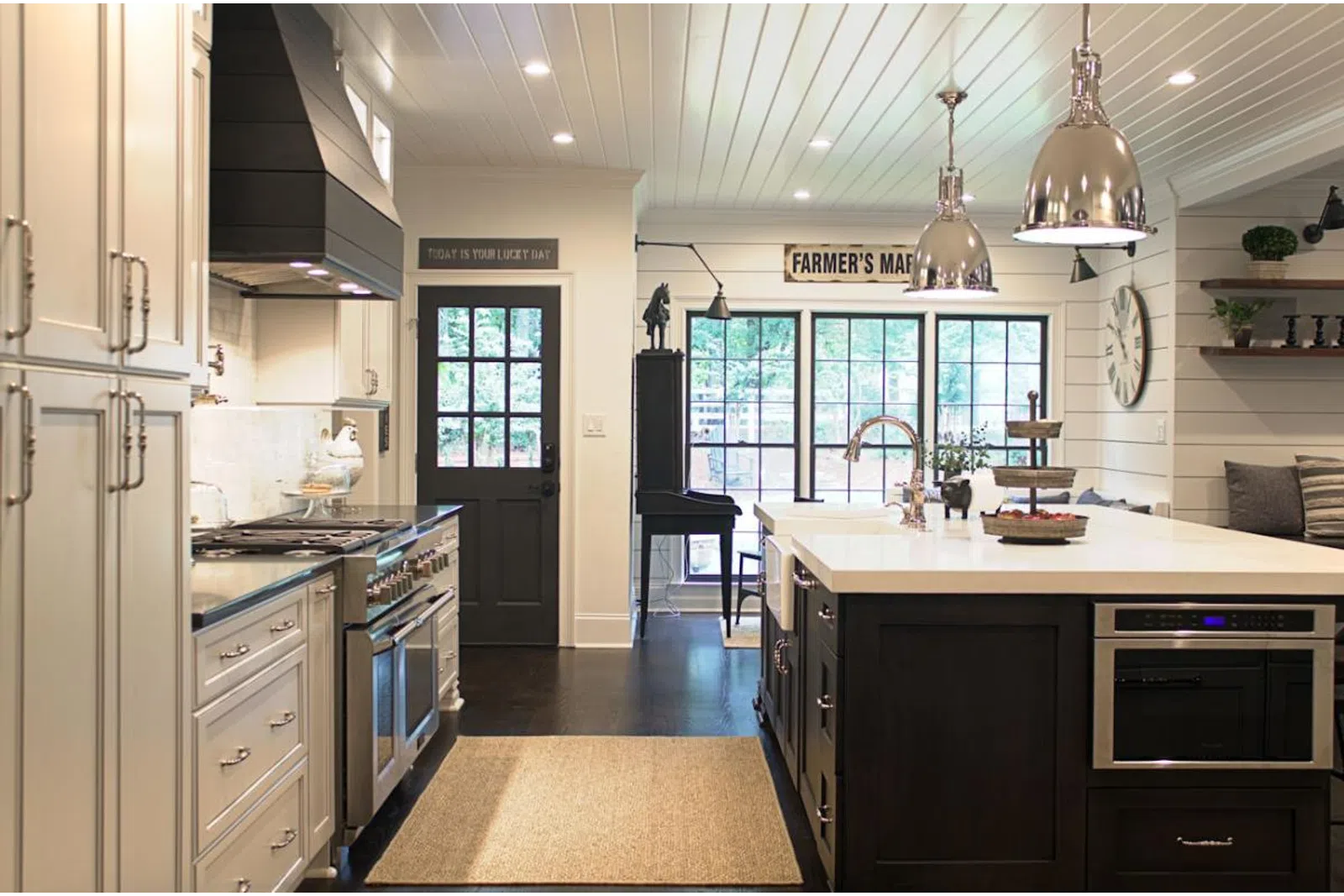 a kitchen with a stove a sink and a window
