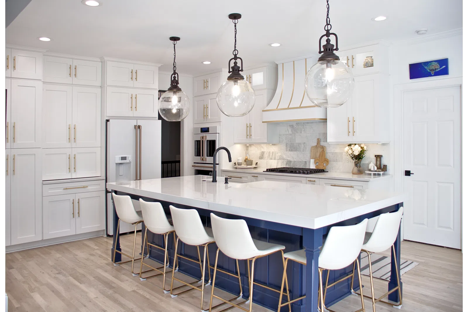 a kitchen with white cabinets