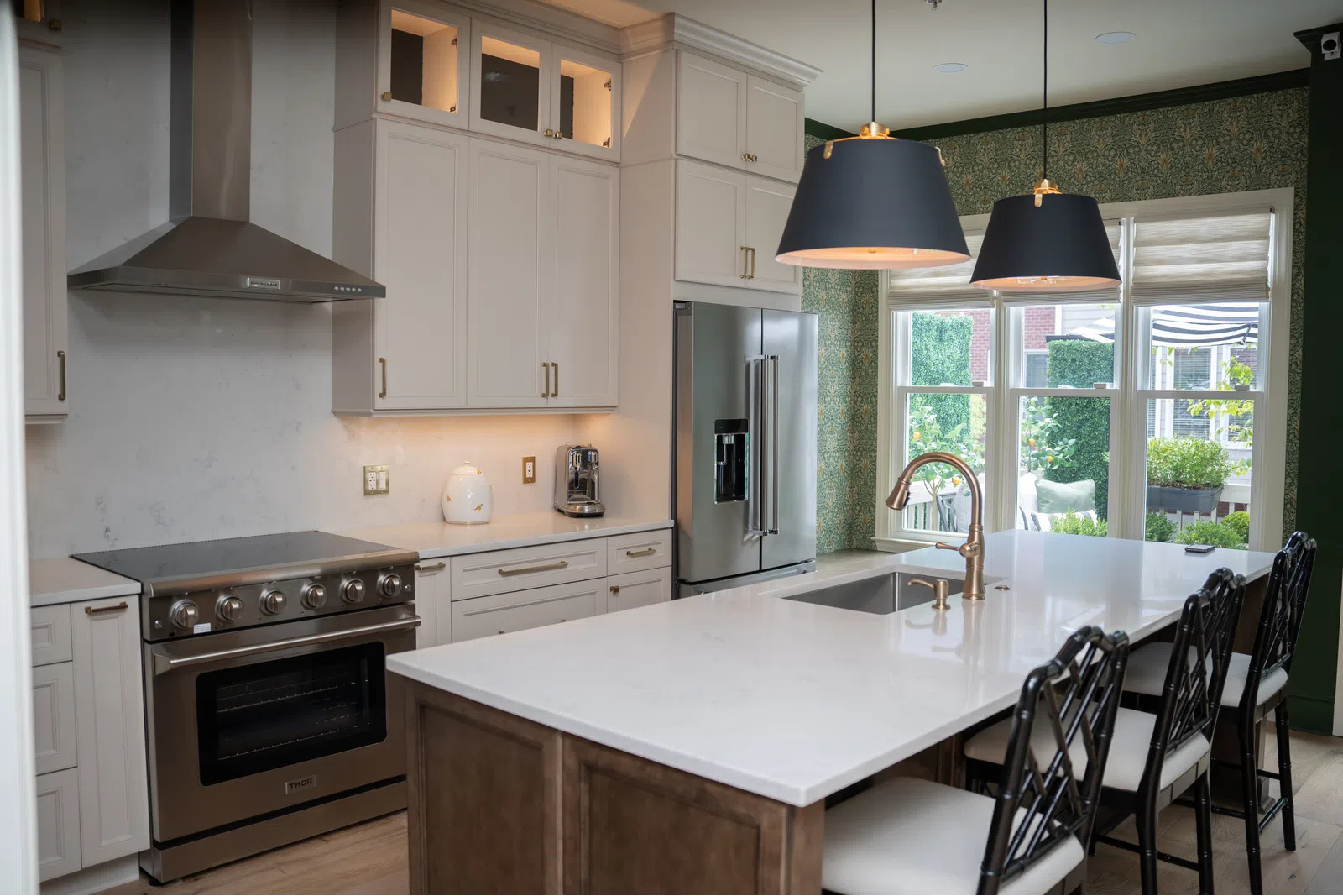 a kitchen with white cabinets