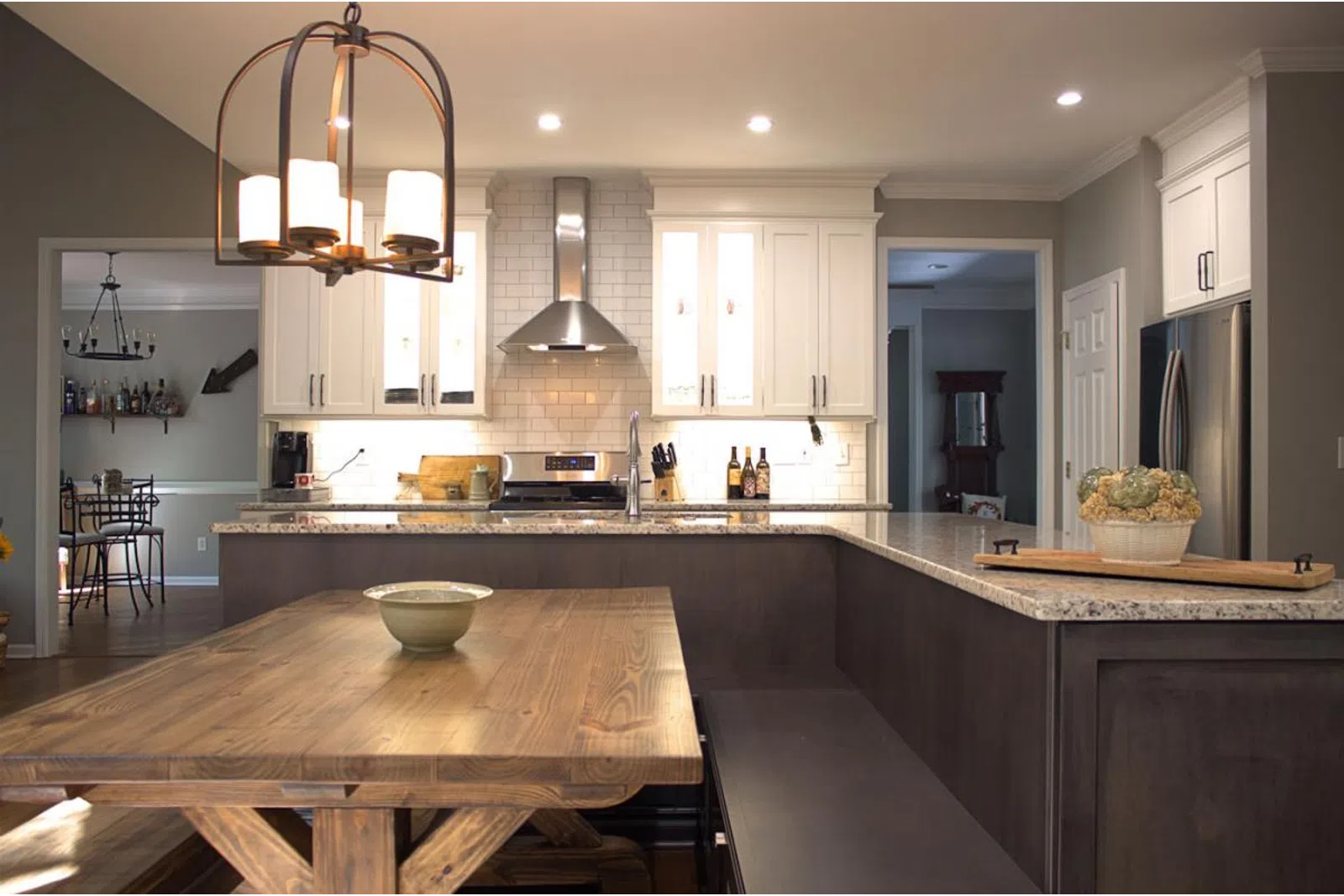 a kitchen with an island in the middle of a table
