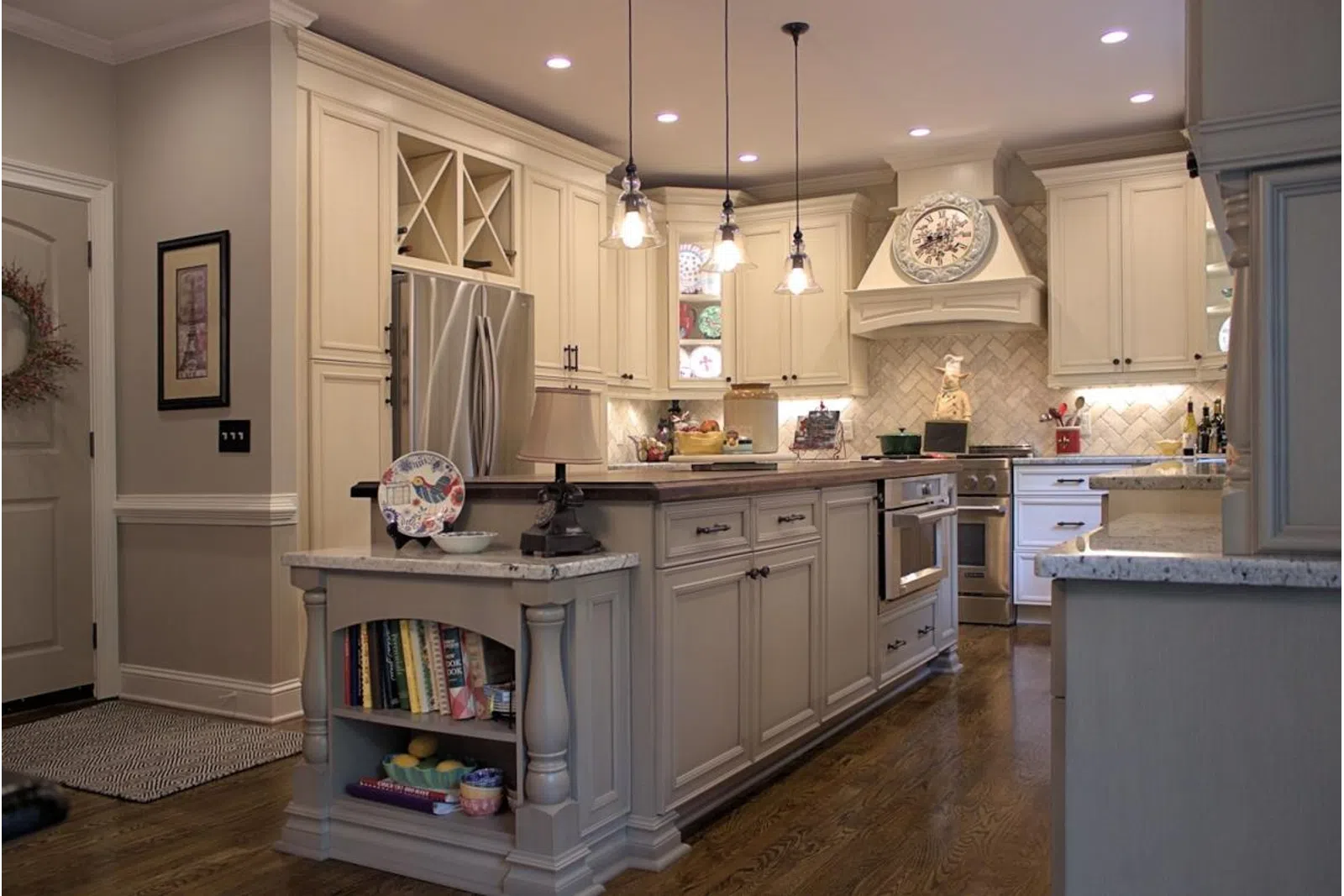 a kitchen with an island in the middle of a room