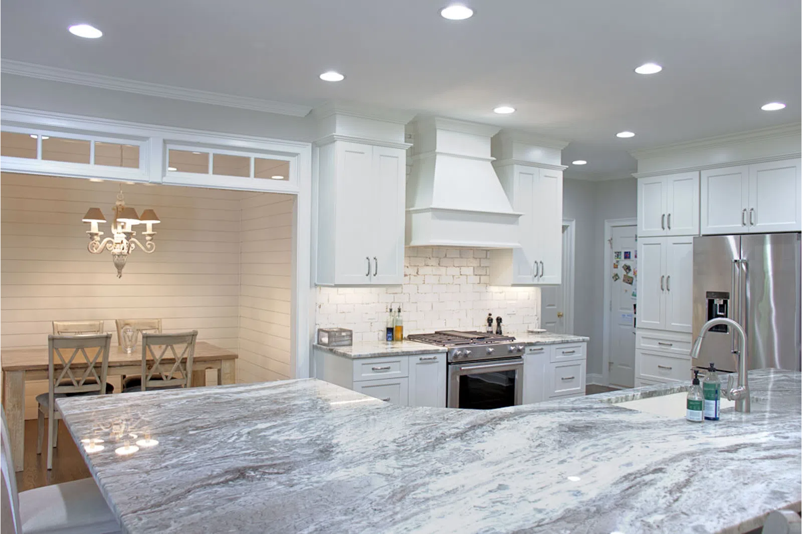 a kitchen with an island in the middle of a room