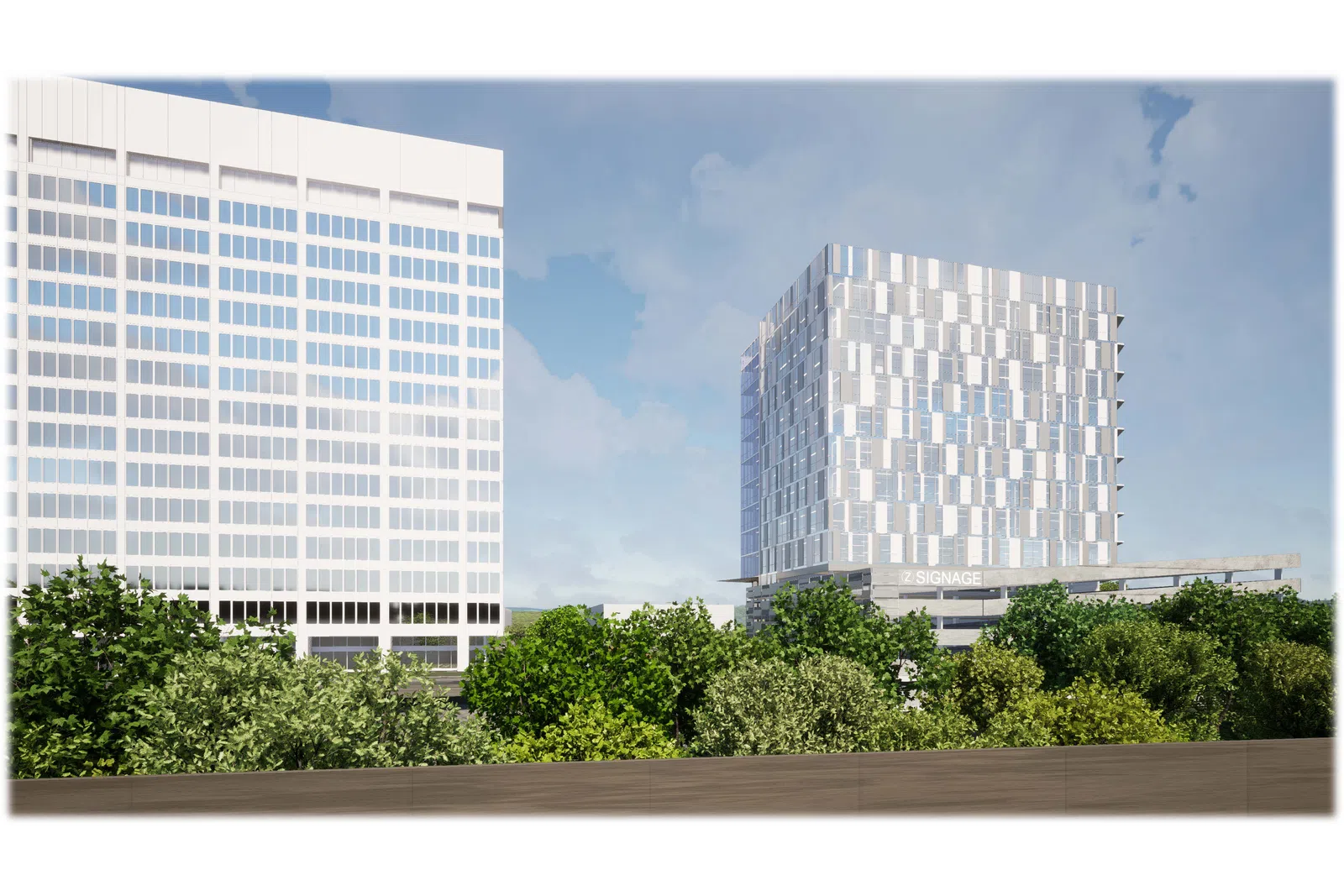 Modern white office buildings behind lush green trees under a partly cloudy blue sky