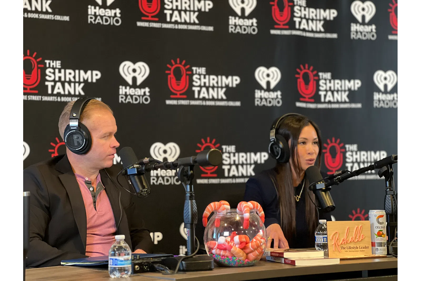 a man and woman wearing headphones