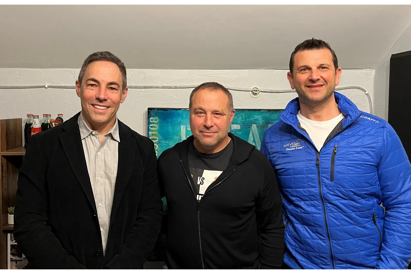 a group of men posing for a photo