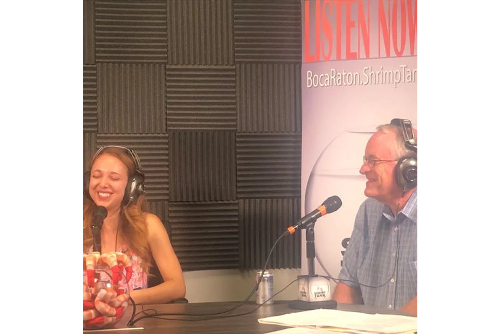 a man and woman wearing headphones