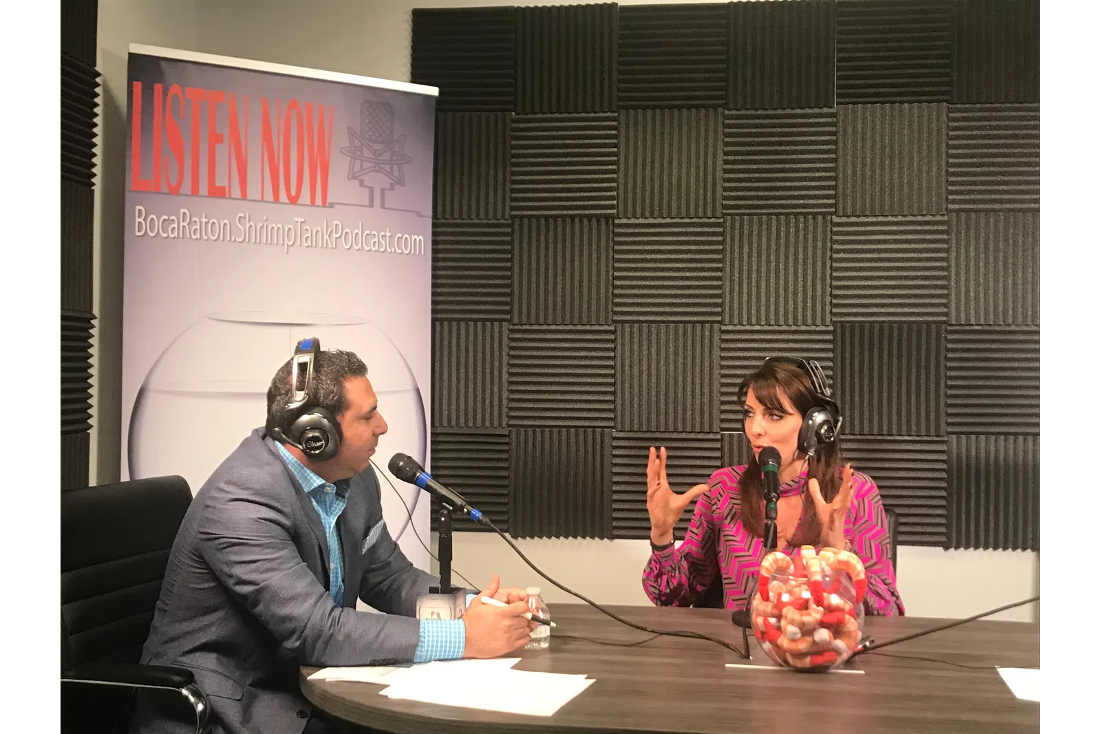 a man and woman wearing headphones