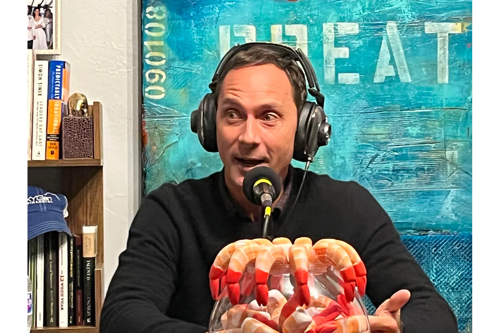 a woman wearing headphones and holding a bag of food