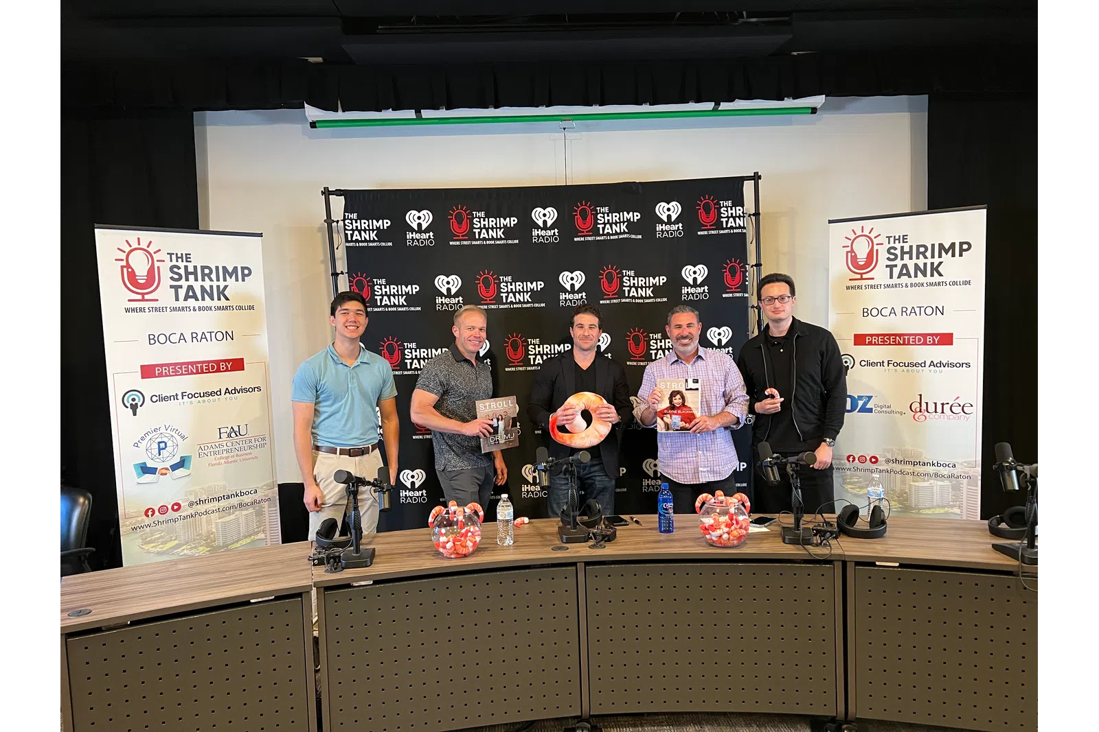 a group of men holding a trophy