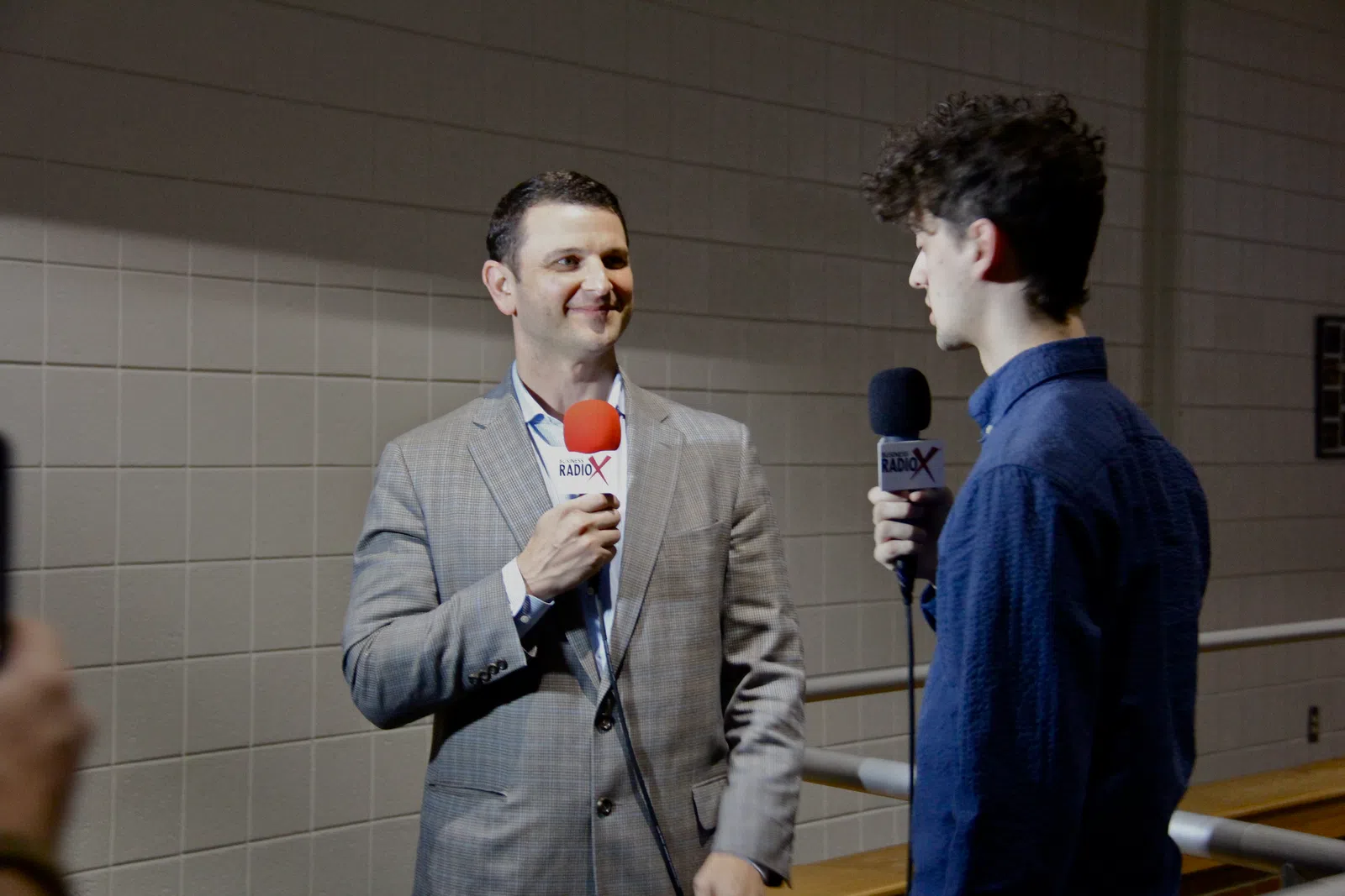 a couple of men holding microphones