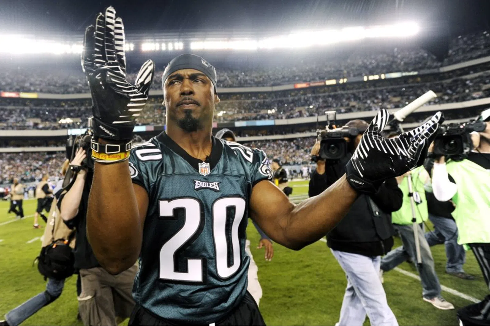 Brian Dawkins holding a football