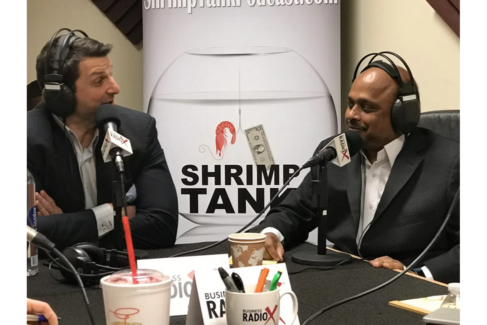 a couple of men wearing headsets