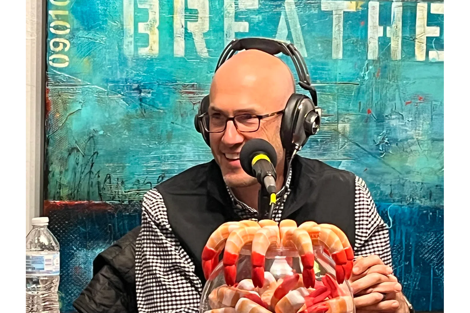 a person wearing headphones and holding a basket of food