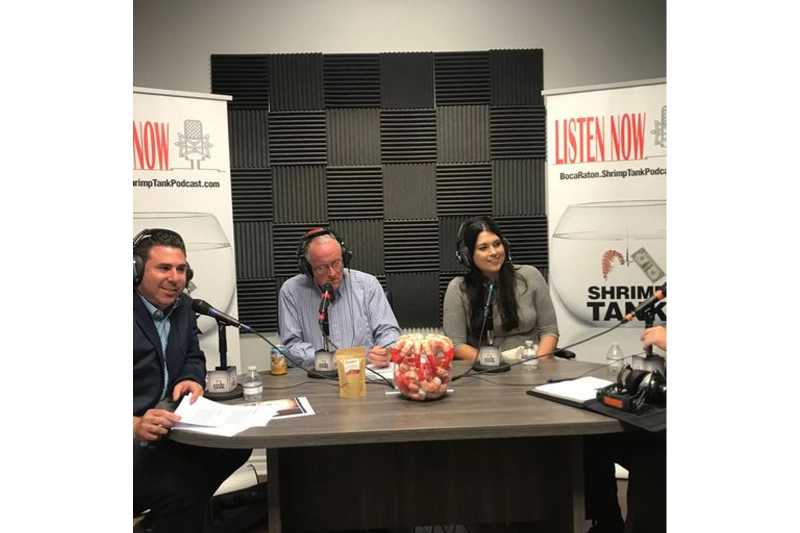 Francisco J. Sánchez et al. sitting at a table with microphones