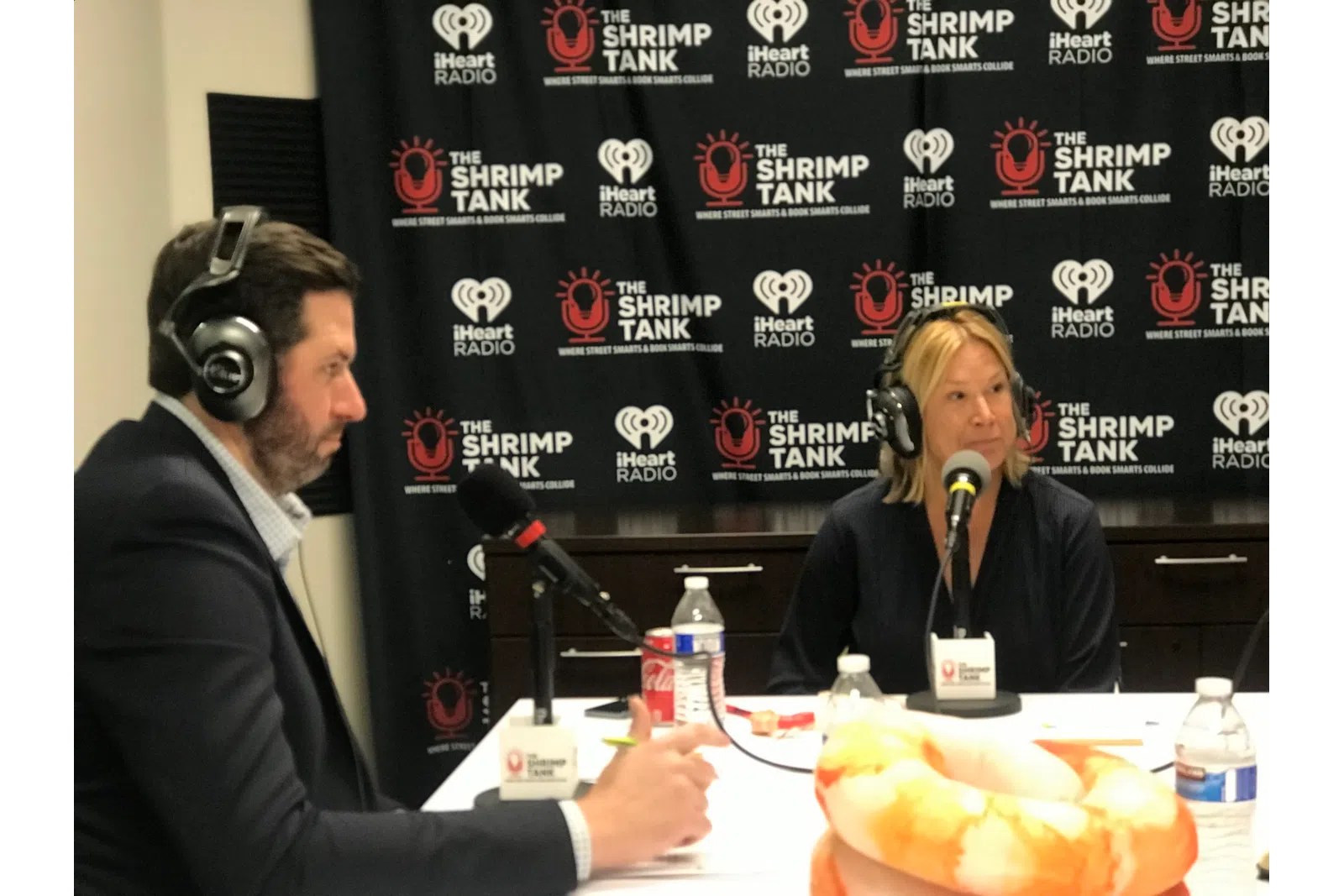 a man and woman wearing headphones