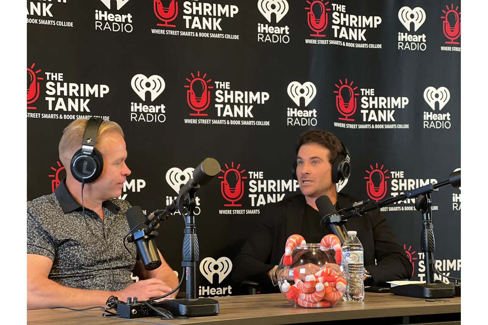 a couple of men wearing headphones