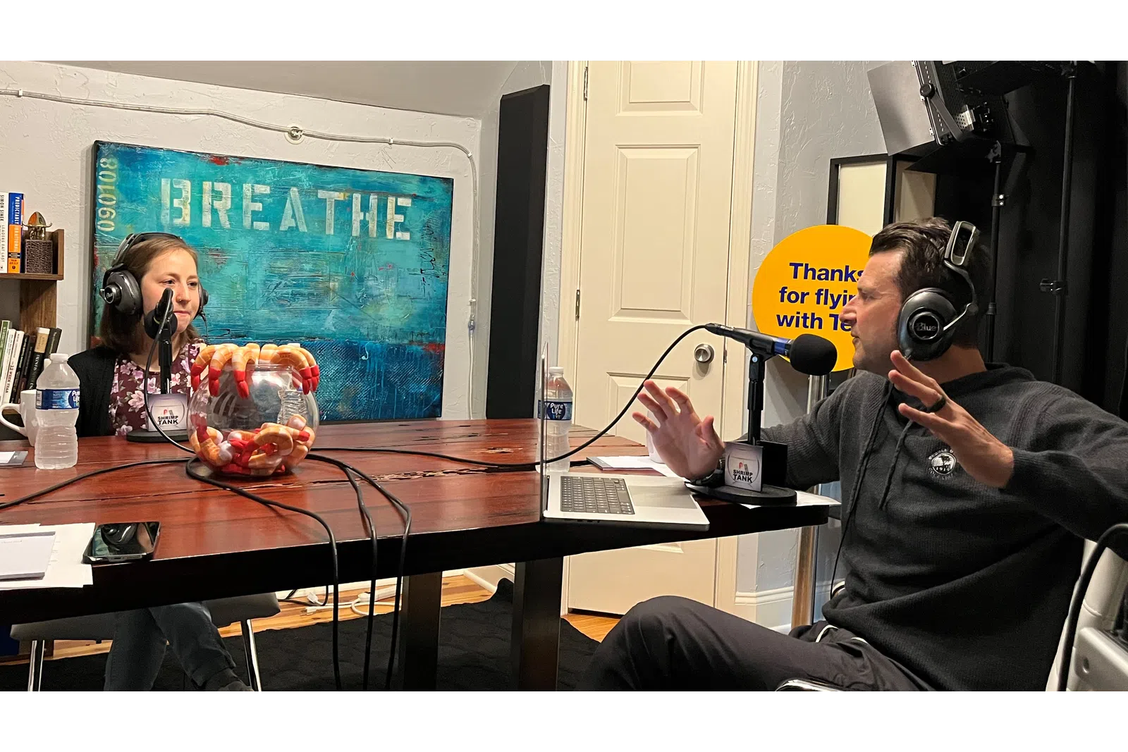 a man and woman wearing headphones