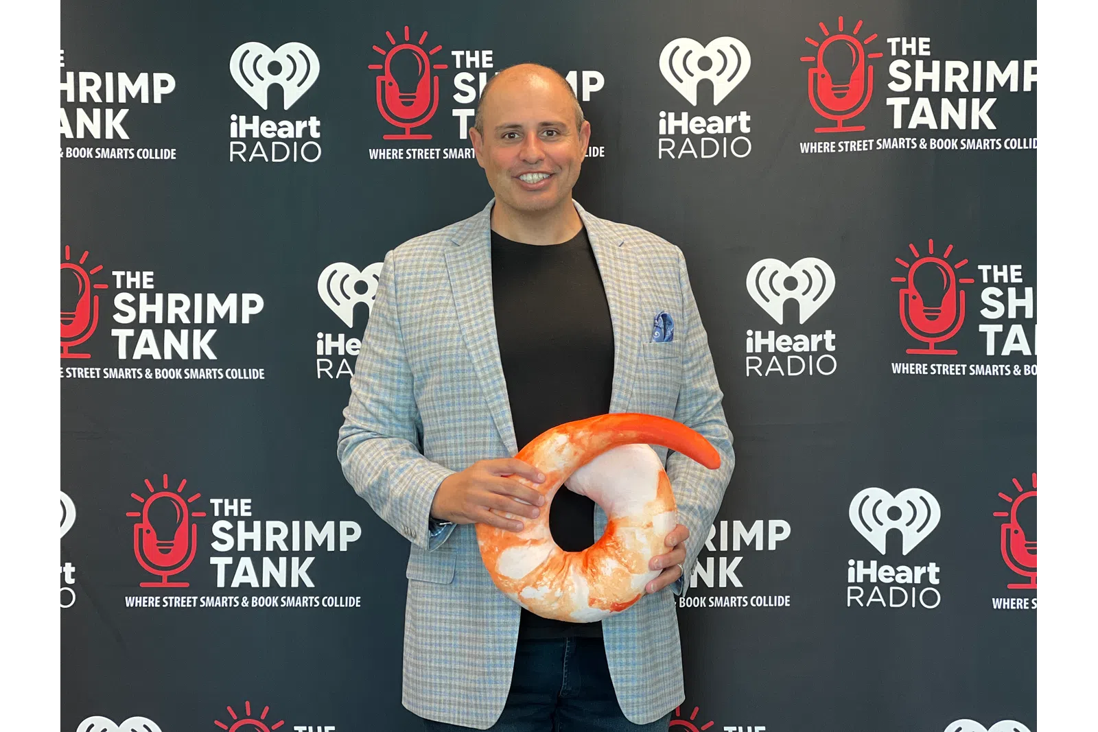 Corey Saban holding a football