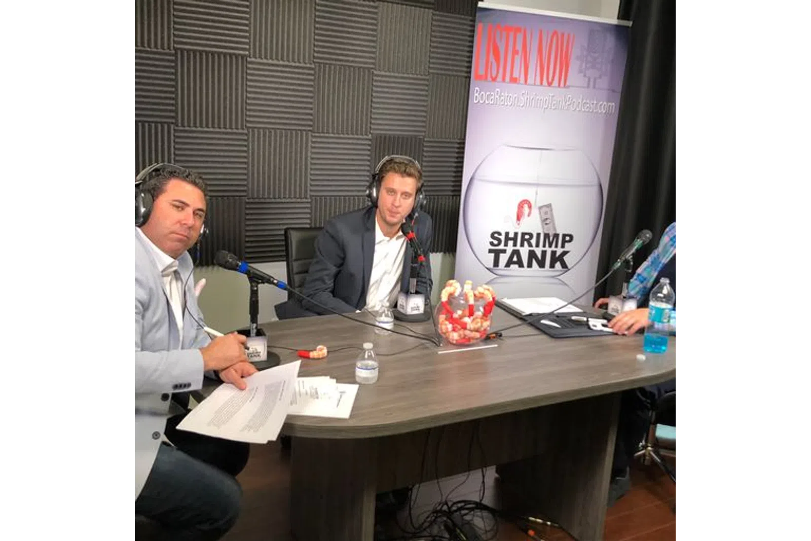 a few men sitting at a table