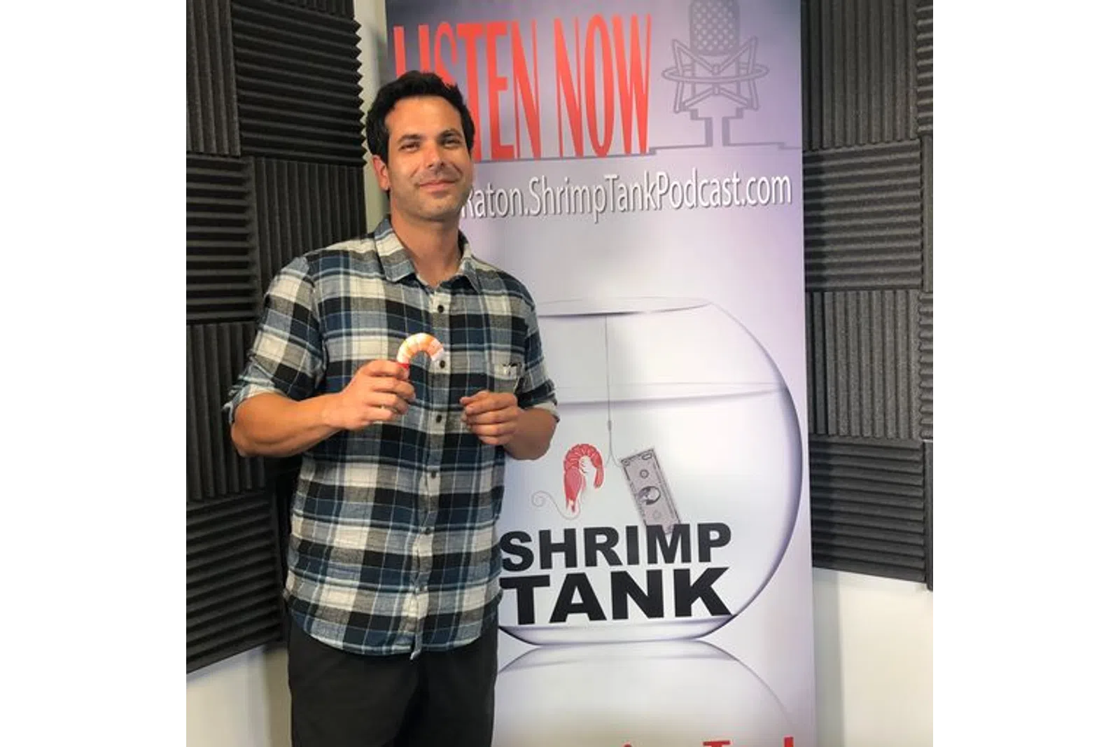 a man holding a bottle of alcohol