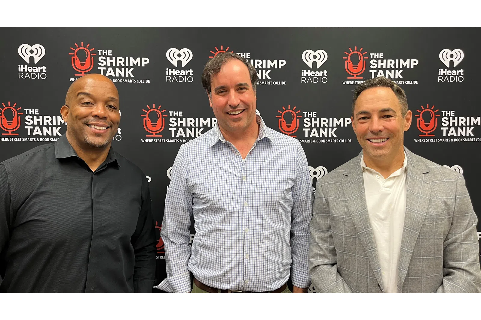 a group of men smiling