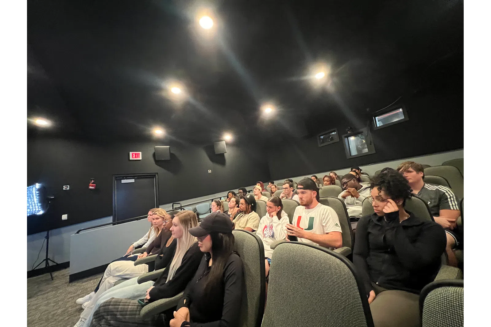 a group of people sitting in a room