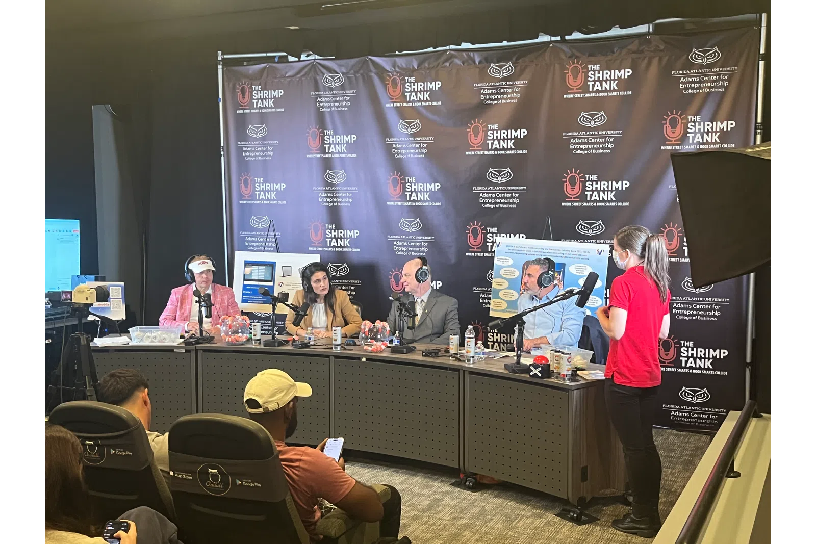 Panel of four judges at The Shrimp Tank event discussing ideas with an audience in a studio setting