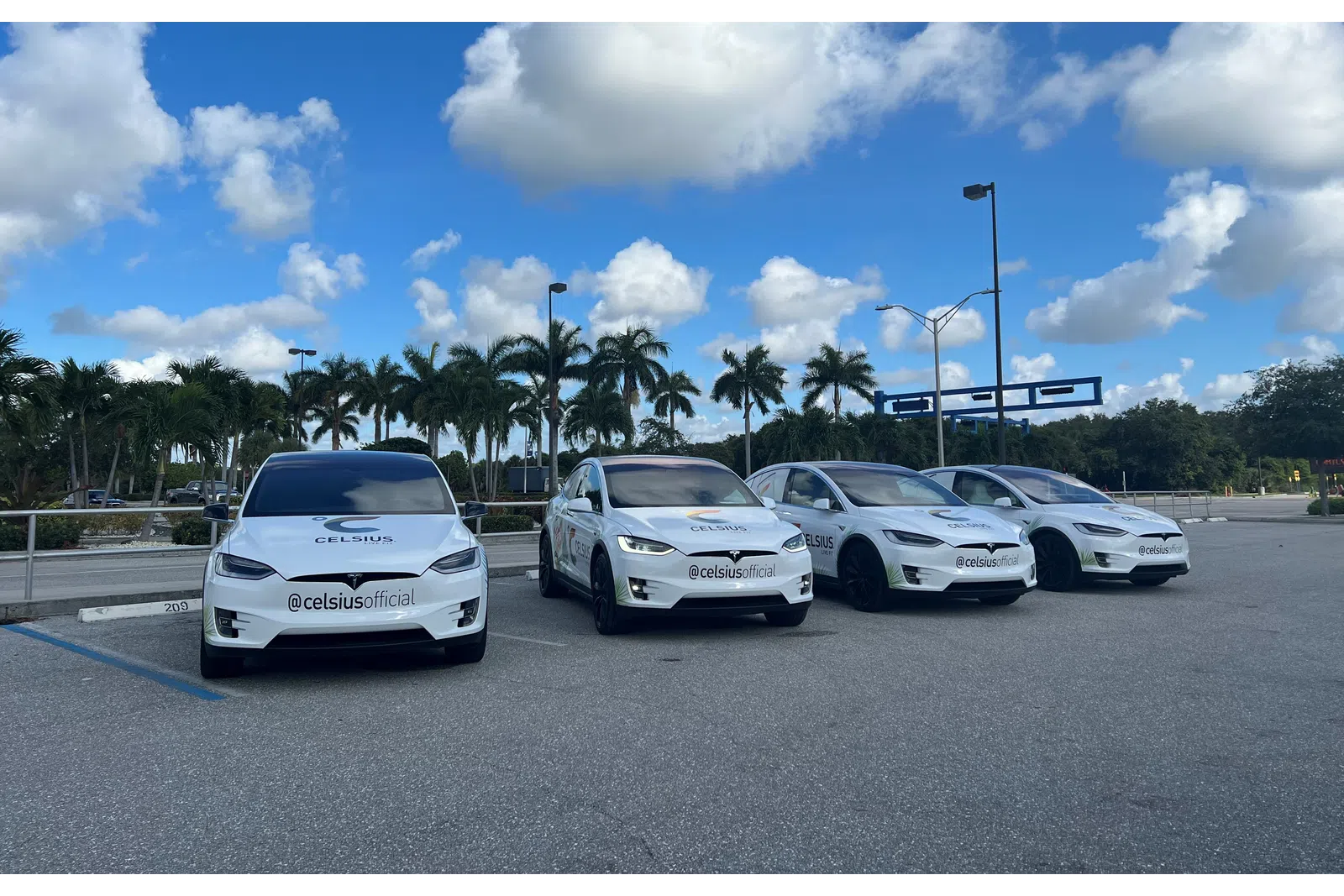 a group of cars parked in a parking lot