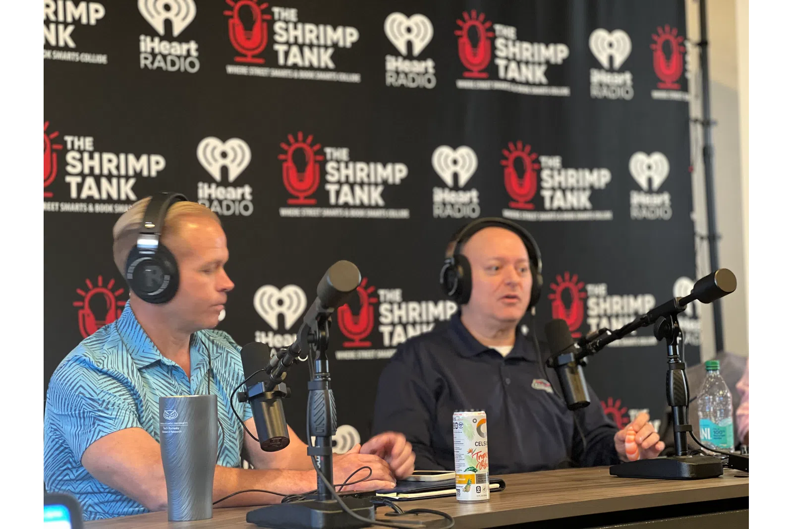 a couple of men wearing headphones