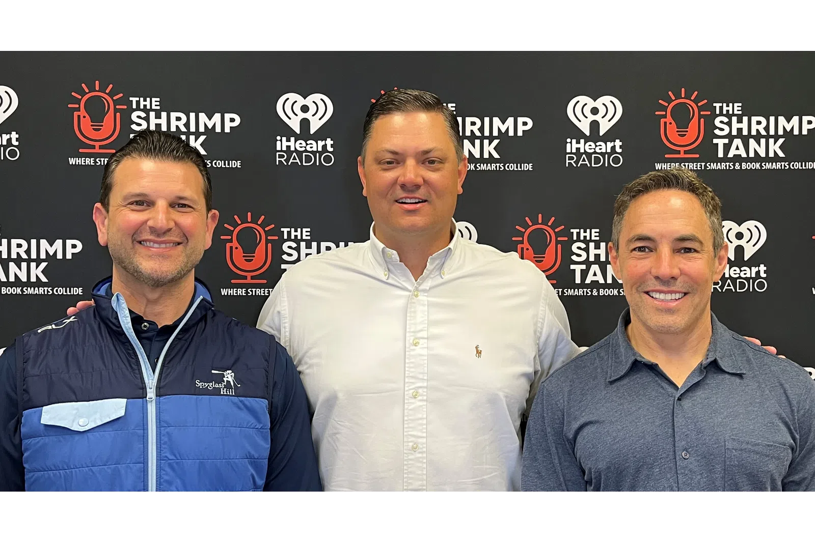 a group of men smiling