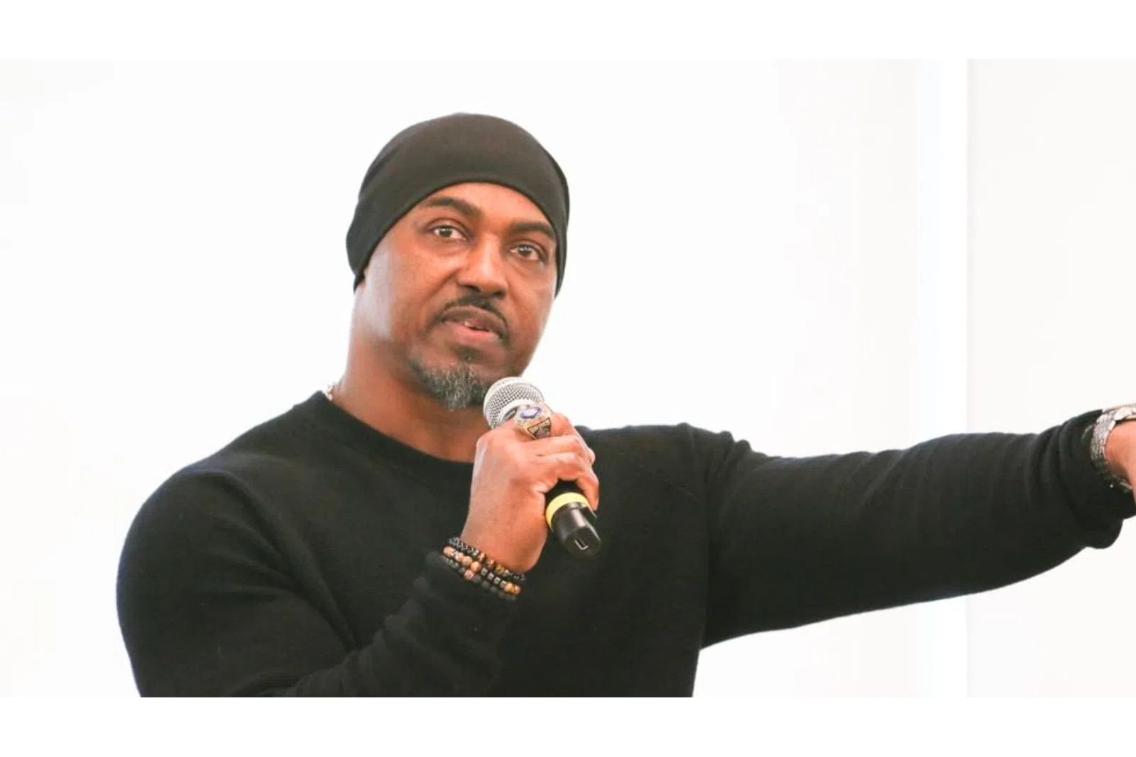 Brian Dawkins holding a microphone