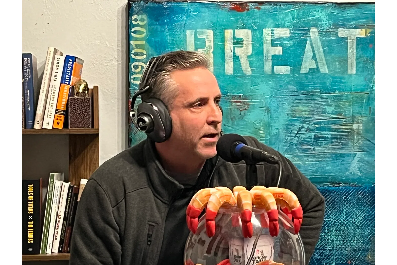a person wearing headphones and holding a bowl of food