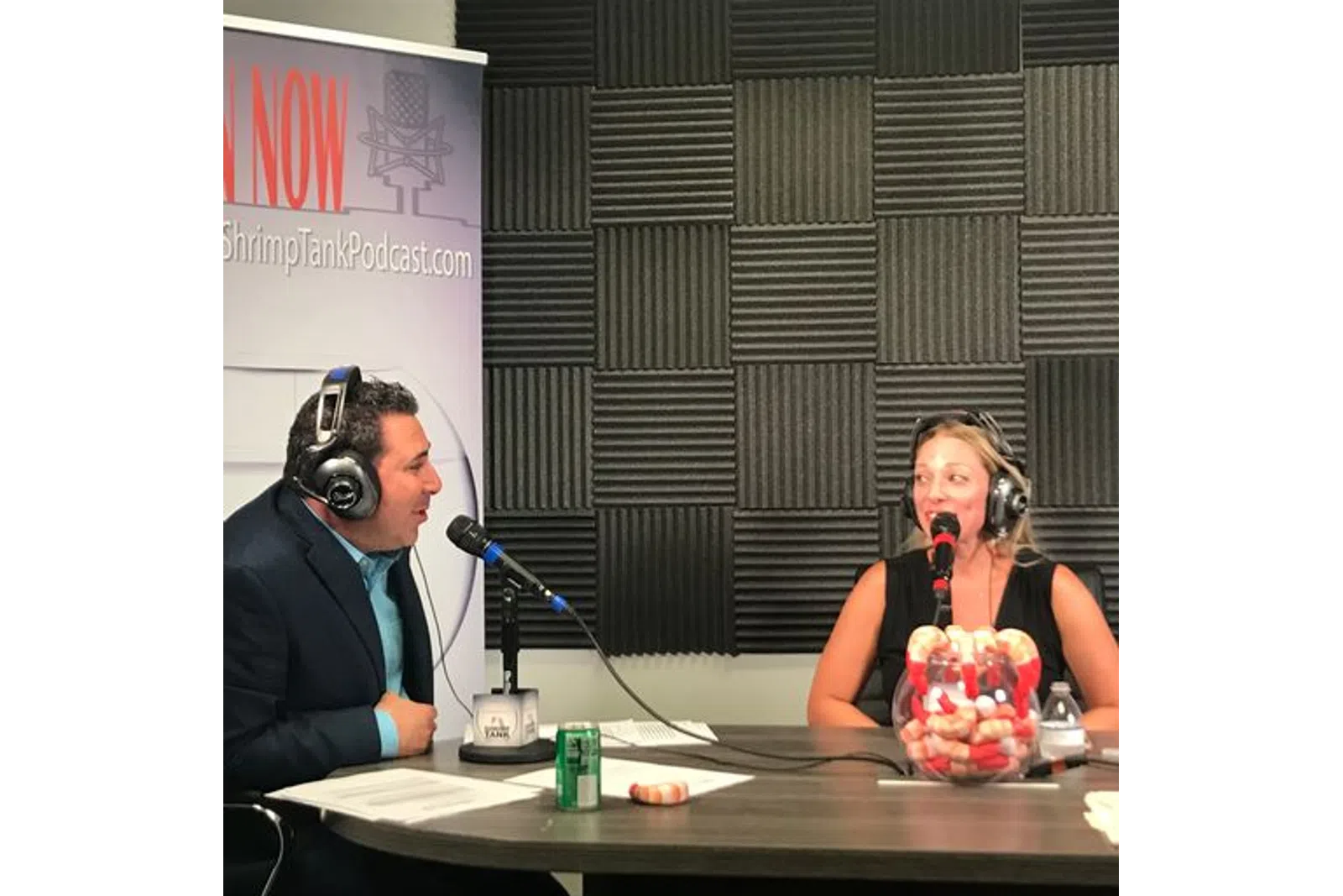 a man and woman wearing headphones