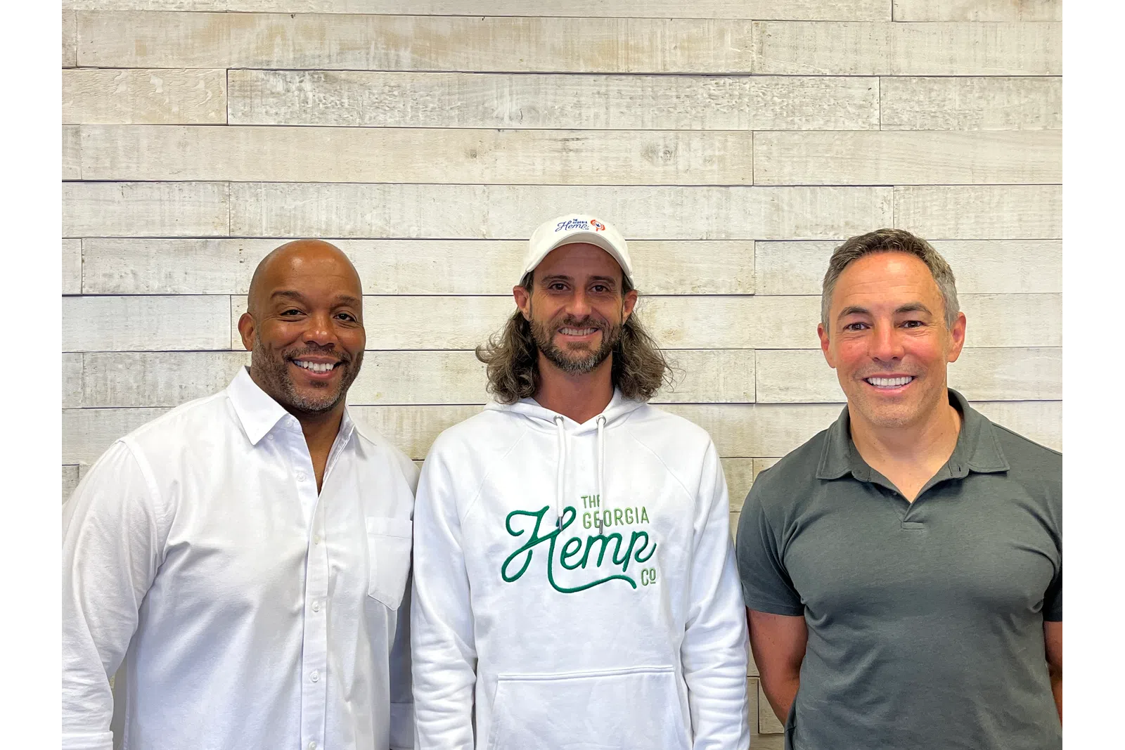 a group of men posing for a photo