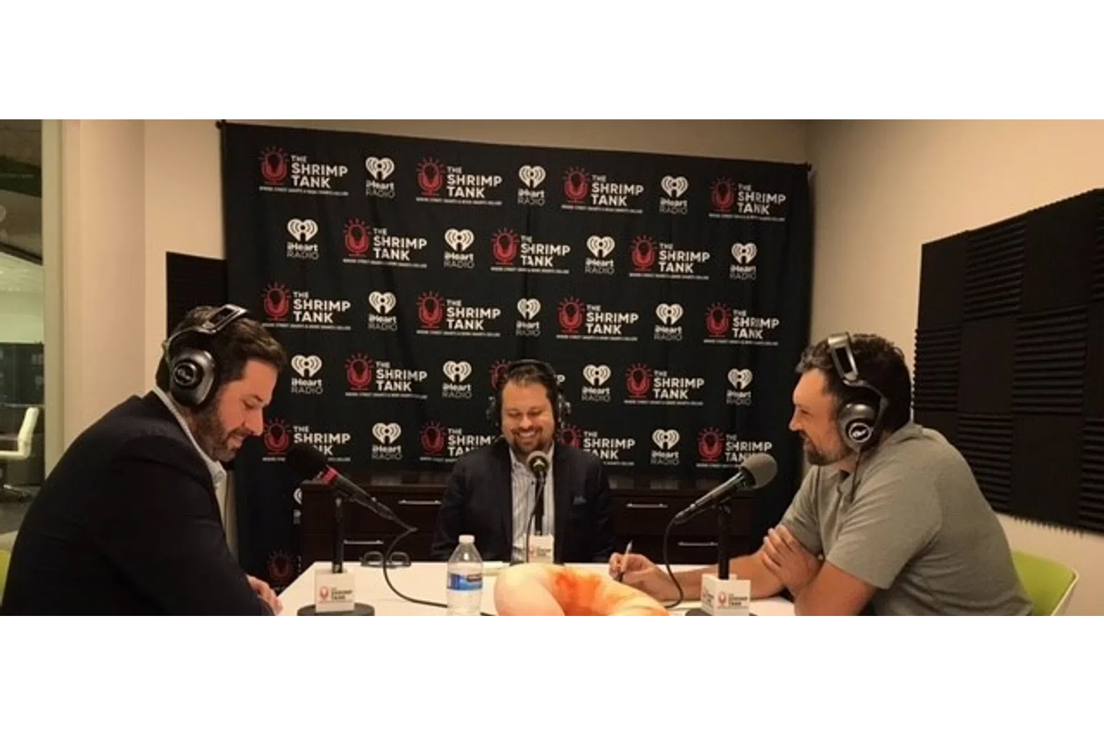 a group of men wearing headphones