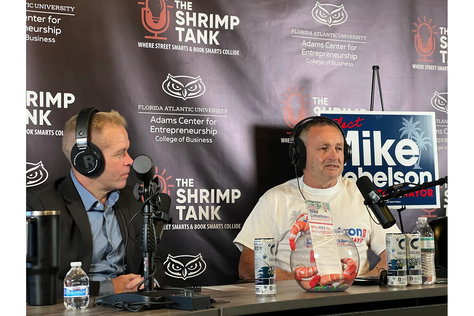 Two men recording a podcast at The Shrimp Tank event with Florida Atlantic University entrepreneurship backdrop.