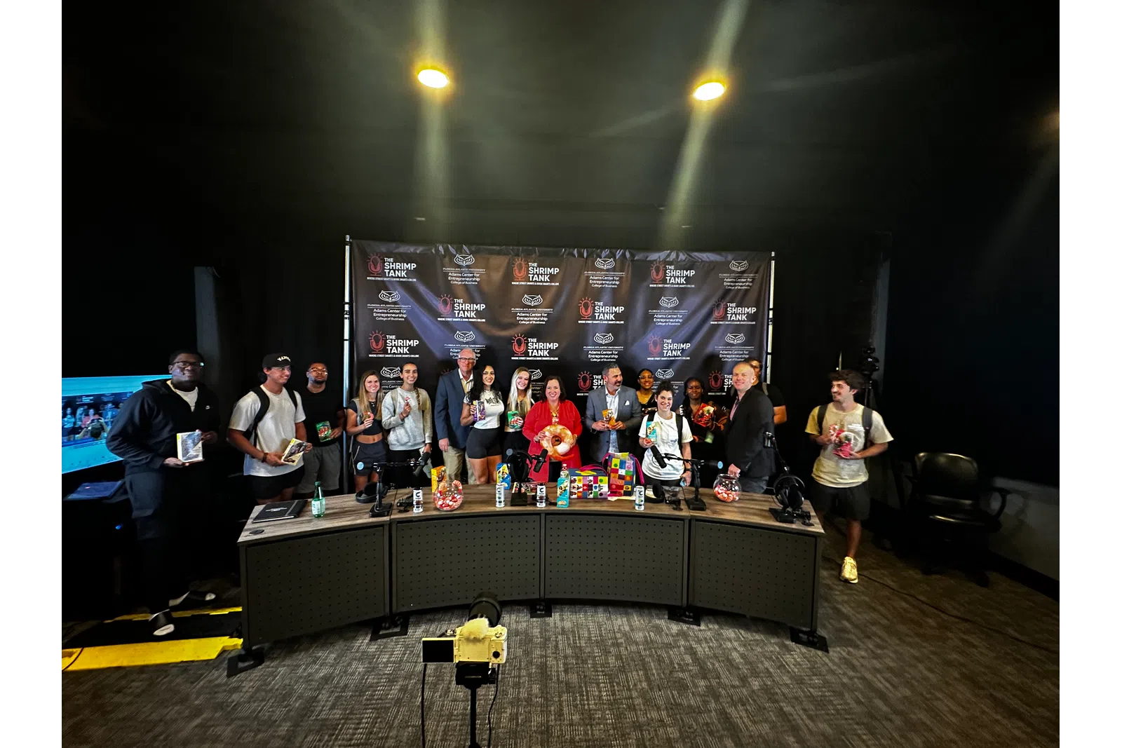 a group of people standing on a stage