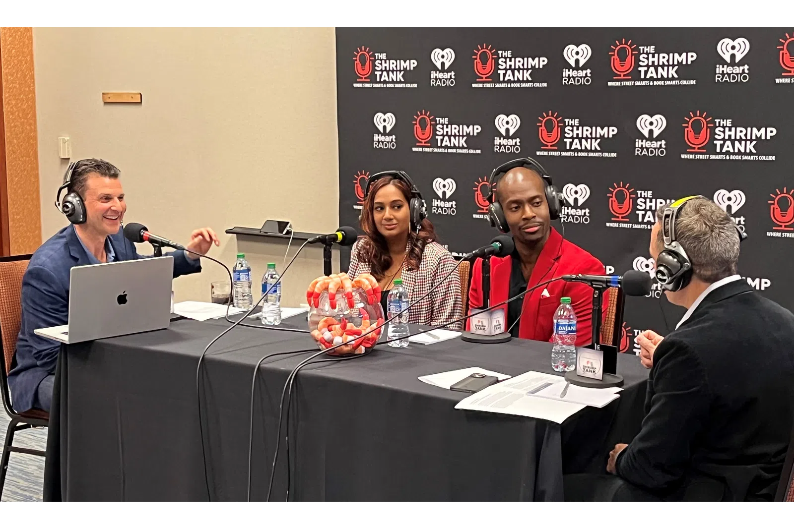 Shobana et al. sitting at a table with microphones