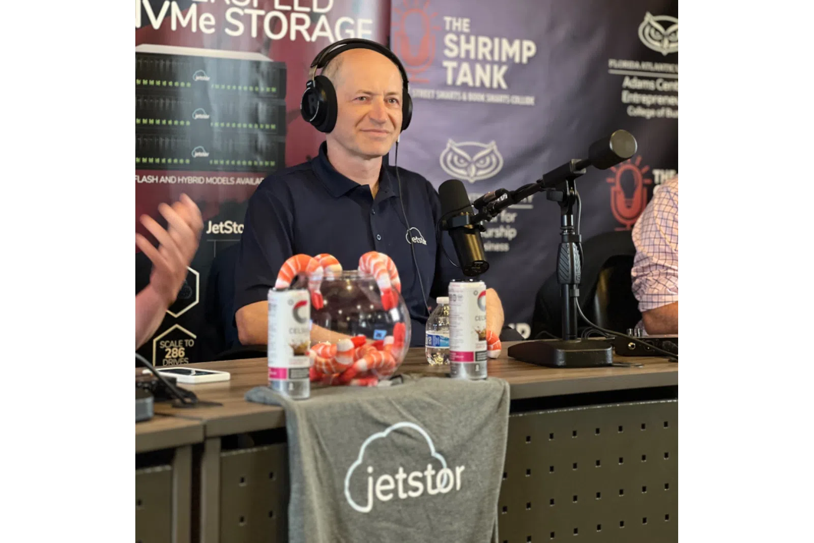 Business professional speaking at a podcast event about NVMe storage technology.