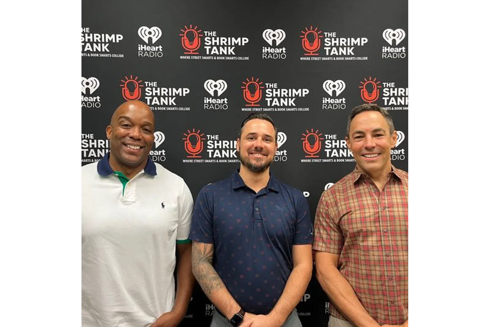 a group of men smiling