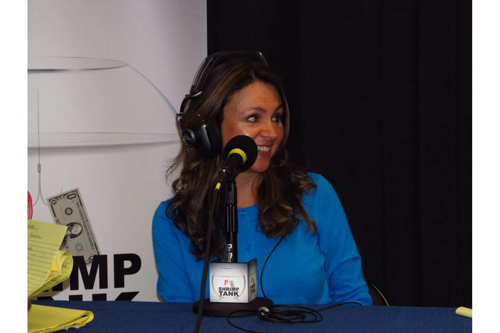 a woman speaking into a microphone